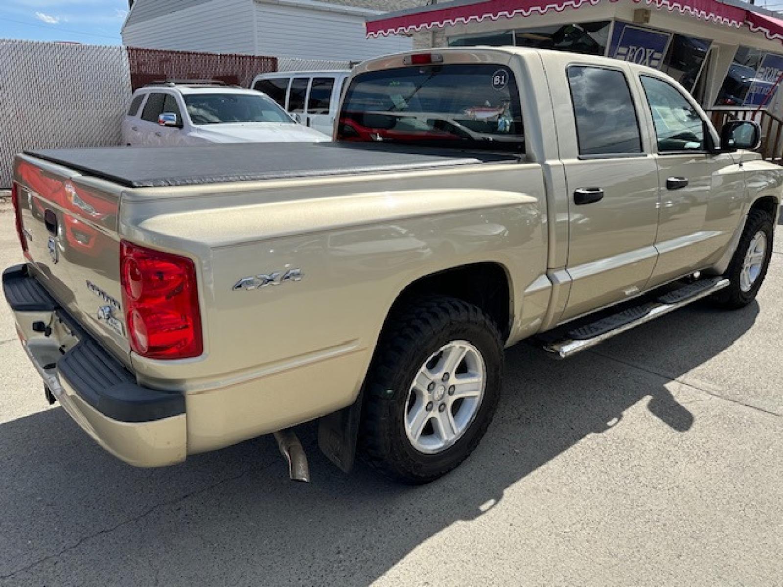 2011 /BEIGE Dodge Dakota SLT (1D7RW3GK3BS) with an 3.7 V6 engine, Automatic transmission, located at 3200 1st Avenue North, Billings, MT, 59101, (406) 245-9055, 45.779270, -108.510742 - Very Nice 4 Door Pickup with A Ton of Options! Power Windows, Power Door Locks, Remote Key Entry, Rugged Terrain Tires, Tilt Steering Column, Cruise Control, 4X4, Running Boards, Tonneau Cover, Towing, Custom Bumper Guard and Only 79,000 Miles. CarFax Dealer Auto Brokers of Montana/AA&A Auto Renta - Photo #3